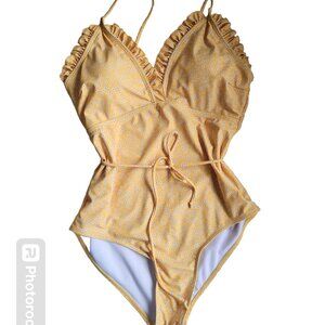 Yellow flower ruffled one piece bathing suit.